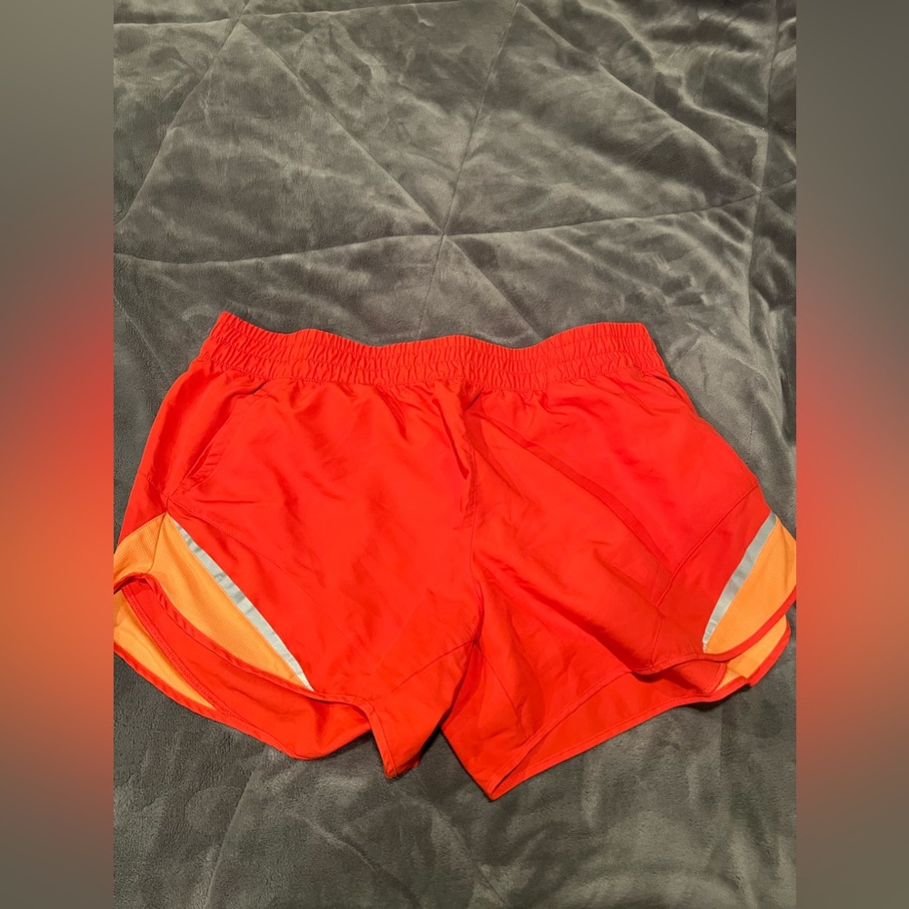 Orange running shorts